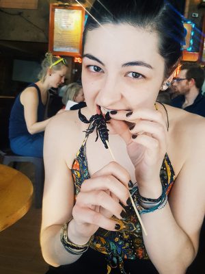 Charlotte eating a scorpion - Bangkok